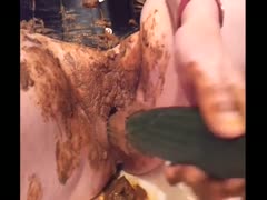 Scat girl uses cucumber to make herself poop
